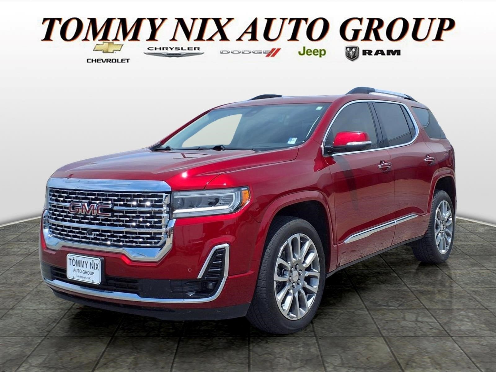 2023 GMC Acadia Denali in Volcanic Red Tintcoat — front three-quarter view