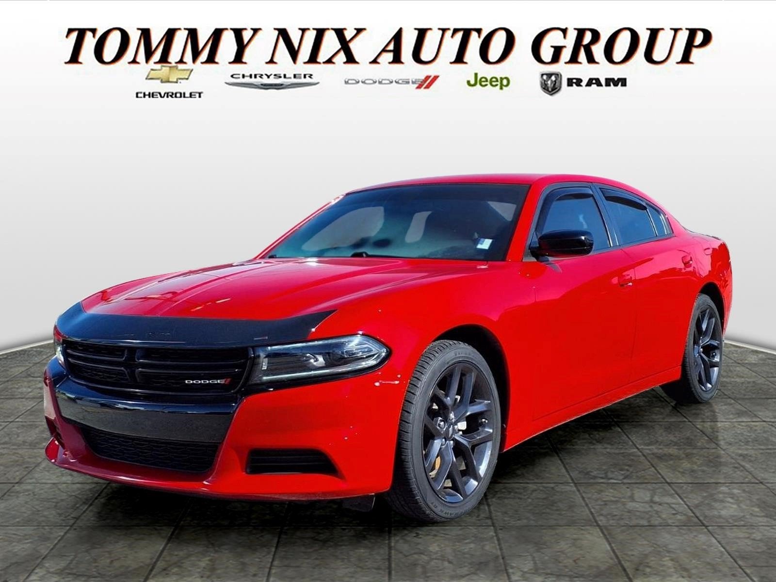 2023 Dodge Charger SXT in Torred Clear Coat — front three-quarter view