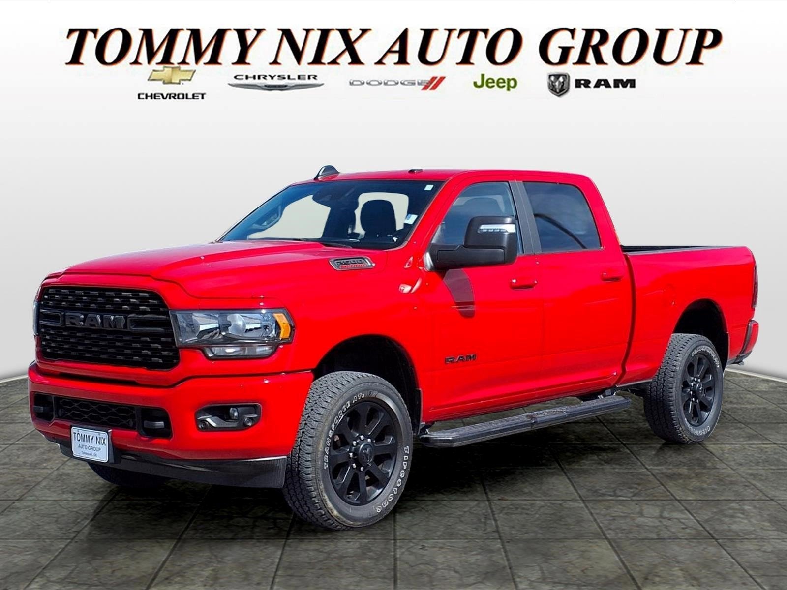 2024 RAM 2500 Big Horn in Red — front three-quarter view