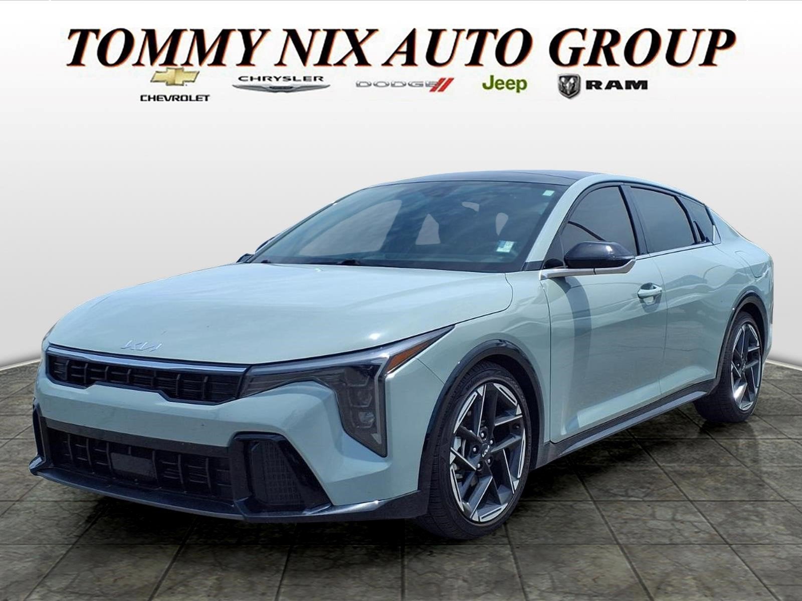 2025 Kia K4 GT-Line in Morning Haze — front three-quarter view