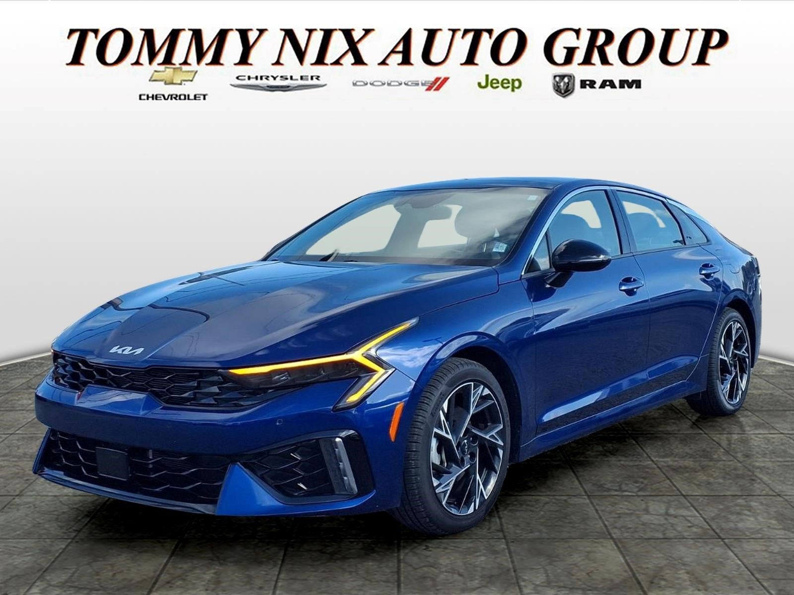 2025 Kia K5 GT-Line in Blue — front three-quarter view